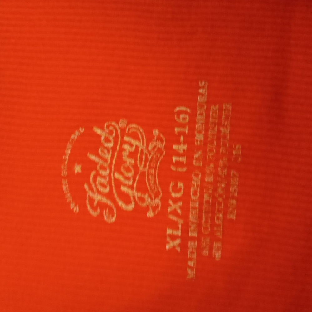 An orange faded clory tank top